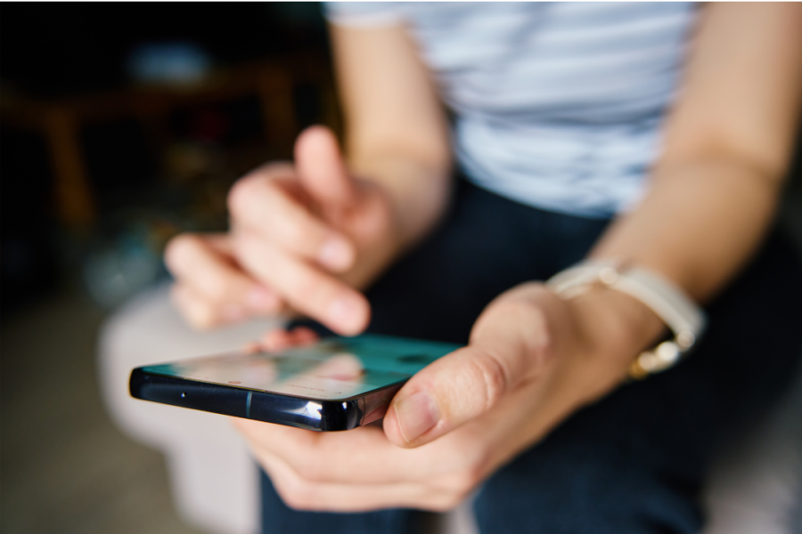 a person scrolls their phone